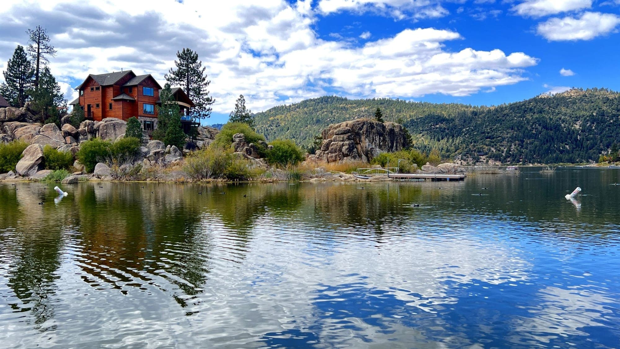 Big Bear Lake with shoreline homes and mountains in the distance